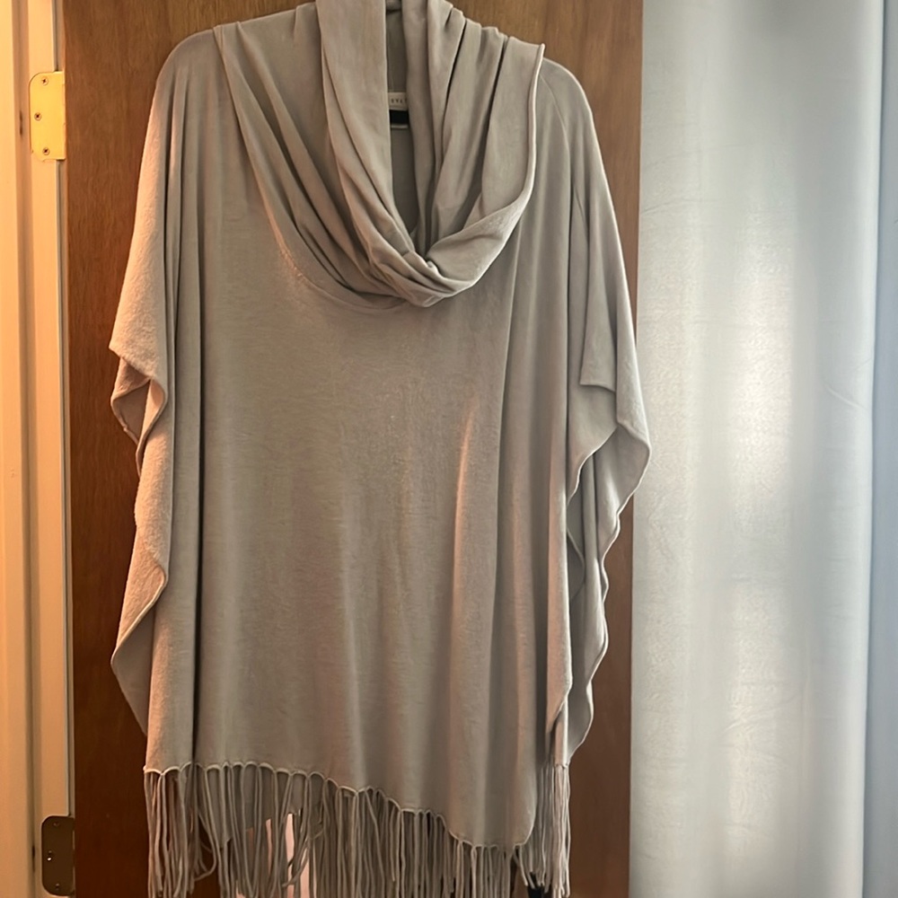 Cowl neck poncho sweater with fringe